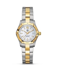 TAG Heuer's Aquaracer series is the reference professional diving watch. Water resistant to 300M, with a white mother-of-pearl dial and a steel and 18K gold bracelet. TAG Heuer's Aquaracer series is the reference professional diving watch. Water resistant to 300M, with a white mother-of-pearl dial and a steel and 18K gold bracelet.