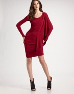 A stretch jersey style with long sleeves and luxurious draping along the side.Crewneck Long sleeves Tucked along side seams Side draping About 23 from natural waist 95% rayon/5% spandex Hand wash Imported Additional Information Women's Premier Designer & Contemporary Size Guide 