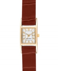 Simplicity yields a stunning finish, by Nine West. Watch crafted of textured brown leather strap and rectangular gold tone mixed metal case. Silver tone dial features gold tone numerals, minute track, gold tone hour and minute hands, sweeping second hand and logo at six o'clock. Quartz movement. Limited lifetime warranty. Simplicity yields a stunning finish, by Nine West. Watch crafted of textured brown leather strap and rectangular gold tone mixed metal case. Silver tone dial features gold tone numerals, minute track, gold tone hour and minute hands, sweeping second hand and logo at six o'clock. Quartz movement. Limited lifetime warranty.
