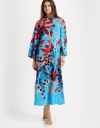 A bold abstract print covers this long silhouette, perfect for layering with your favorite pieces. Pull-over styleMandarin collarLong sleevesAbout 52 from shoulder to hemPolyesterMachine washImported