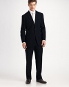 The essential black suit, timeless and elegant in 100% wool crepe. Made in Italy. Dry clean.JACKETTwo button silhouette with notch lapel Chest welt pocket Besom pockets Button cuffs Side vents Fully lined About 30 from shoulder to hemPANTSFlat front, belt loops Zip fly Lined to knee Quarter top pockets Side pockets Button back welt pockets Unfinished hemPlease note: Alterations are available at all Saks Fifth Avenue stores. 