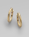 From the Martellato Collection. Soft, romantic grooves put a vintage texture to classic, 18k yellow gold hoops. 18k yellow gold Diameter, about 1 Hinge close Made in Italy 