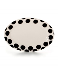 With platinum-banded dots in white porcelain, the Black Pearl oval platter from Cru offers fine dining without the formality. With platinum-banded dots in white porcelain, the Black Pearl oval platter from Cru offers fine dining without the formality.