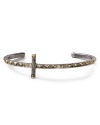 Gold-plated pyramid studs shine on this cool-girl cross cuff in gunmetal from House of Harlow 1960.