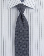 A sophisticated look woven in Italian silk, with a polished diamond pattern.SilkDry cleanMade in Italy