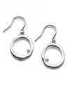 A tiny crystal accent rests in an imperfect circle on this stylish Kenneth Cole New York earrings. Crafted in silvertone mixed metal. Approximate drop: 1 inch.