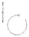Strong but simple. This pair of silver-plated hoop earrings from Michael Kors are the perfect earrings for everyday - wear them as as shapely showpiece.