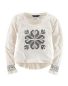 This essential long-sleeved tee in soft stretch cotton jersey is adorned with a festive snowflake print.