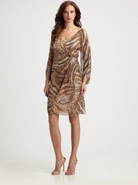 An abstracted animal print lends an exotic touch to this gauzy design.Surplice necklineFront gathersThree-quarter sleevesFully linedConcealed back zip with keyholeAbout 22 from natural waistPolyesterDry cleanImportedModel shown is 5'11 (180cm) wearing US size 4. An abstracted animal print lends an exotic touch to this gauzy design.Surplice necklineFront gathersThree-quarter sleevesFully linedConcealed back zip with keyholeAbout 22 from natural waistPolyesterDry cleanImportedModel shown is 5'11 (180cm) wearing US size 4.