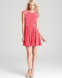 In a vibrant, rosy hue, this ERIN Erin Fetherston dress gets cheeky with lace cutouts. In a vibrant, rosy hue, this ERIN Erin Fetherston dress gets cheeky with lace cutouts.