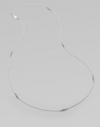 A graceful sterling silver chain, delicately spaced with clusters of tiny, faceted 14k gold beads.14k yellow gold and sterling silverLength, about 26Spring ring claspMade in USA
