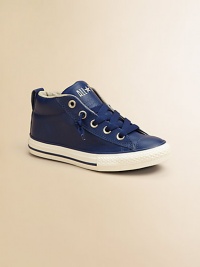 Upgrade his cool-factor with this signature Chuck Taylor design in rich leather. Lace-up closureLeather upperRubber soleTraditional Chuck insoleImported Upgrade his cool-factor with this signature Chuck Taylor design in rich leather. Lace-up closureLeather upperRubber soleTraditional Chuck insoleImported