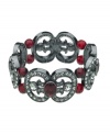 Seasonally stylish. Featuring black and faceted red crystals, T Tahari's Crystal Elegance Collection stretch bracelet will be a fashionable finishing touch for your fall wardrobe. Set in hematite tone mixed metal, it's nickel free and ideally suited for sensitive skin. The stretch design offers a comfortable, flexible fit. Approximate diameter: 2-1/4 inches.