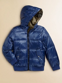 Weather-resistant nylon on one side, smart checks on the other, both quilted, both sporty, both ready to keep your young man stylishly warm.Attached hoodFront zipperLong sleeves with ribbed knit cuffsEmbroidered chest logo on solid sideAngled front pocketsRibbed knit waistbandNylonMachine washImported Weather-resistant nylon on one side, smart checks on the other, both quilted, both sporty, both ready to keep your young man stylishly warm.Attached hoodFront zipperLong sleeves with ribbed knit cuffsEmbroidered chest logo on solid sideAngled front pocketsRibbed knit waistbandNylonMachine washImported
