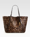 A chic haircalf style in an exotic animal print accented with smooth leather trim.Double adjustable leather top handles, 8¾-9½ dropMagnetic snap closureOne inside zip pocketTwo inside open pocketsSuede lining14W X 12H X 7DImported