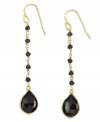 Bold beadwork. Black onyx beads and teardrops (11 ct. t.w.) stand out against a polished 18k gold over sterling silver setting. Approximate drop: 2 inches.