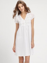 Bloom into spring with this pretty gown, with intricately crocheted floral embroidery and romantic cap sleeves. V-neckHalfway button closureCrocheted lace bodiceCap sleeves with lace trimPleating for added drapeAbout 37½ from shoulder to hemMercerized cottonEmbroidery: polyesterMachine washImported Bloom into spring with this pretty gown, with intricately crocheted floral embroidery and romantic cap sleeves. V-neckHalfway button closureCrocheted lace bodiceCap sleeves with lace trimPleating for added drapeAbout 37½ from shoulder to hemMercerized cottonEmbroidery: polyesterMachine washImported