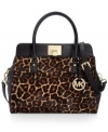 MICHAEL Michael Kors gives the ladylike satchel an edgy update with leopard print haircalf, stud accents and and signature hardware. But don't let this silhouette's luxe look fool you: it's roomy, pocket-trimmed interior perfects practical style.