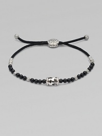 Adjustable pull cord design pairs a beautiful blend of semi-precious stones and sterling silver beads. Available in black onyx and coral.Sterling silverAdjustable pull cordAbout 3 diam.Imported