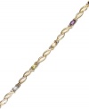 All the colors of the rainbow. Victoria Townsend's oval link bracelet features oval-cut amethyst (1/2 ct. t.w.), blue topaz (1/4 ct. t.w.), citrine (1/5 ct. t.w.), garnet (1/2 ct. t.w.), peridot (1/4 ct. t.w.) and diamond accents. Set in 18k gold over sterling silver. Approximate length: 7-1/4 inches.