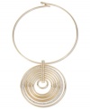Go round and round. This captivating collar necklace from Haskell shines with crystal accents on a hypnotizing multi-circle pendant. Crafted in gold tone mixed metal. Approximate length: 14 inches. Approximate drop  length: 3-1/2 inches. Approximate drop width: 3-1/4 inches.