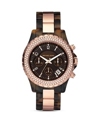 An ultra-stylish timepiece from MICHAEL Michael Kors with crystal-embellished bezel and tortoise and rose gold tone bracelet. An ultra-stylish timepiece from MICHAEL Michael Kors with crystal-embellished bezel and tortoise and rose gold tone bracelet.