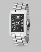 A solid stainless bracelet band offsets a black dial on this signature timepiece. Quartz movement Rectangular case Roman numeral markers Sub dial with second hand Imported