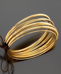 Versatile and stylish, these eight shining bangles will dress up any look, from work to weekend. Crafted in goldtone mixed metal, by Lauren by Ralph Lauren. Approximate diameter: 2-3/4 inches. Versatile and stylish, these eight shining bangles will dress up any look, from work to weekend. Crafted in goldtone mixed metal, by Lauren by Ralph Lauren. Approximate diameter: 2-3/4 inches.