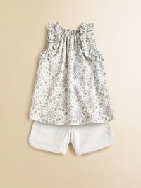 Fun pop-art flowers on woven cotton are adorably adorned with fluffy ruffles at the arm openings in an easy, edgy top.Elasticized gathered necklineSleeveless with ruffled trimKeyhole button-and-loop back closeSlight A-line shapeCottonMachine washImported Fun pop-art flowers on woven cotton are adorably adorned with fluffy ruffles at the arm openings in an easy, edgy top.Elasticized gathered necklineSleeveless with ruffled trimKeyhole button-and-loop back closeSlight A-line shapeCottonMachine washImported