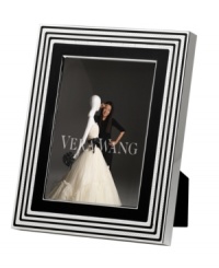 Add new elegance to beautiful memories with Vera Wang's With Love Noir picture frame. Geometric detail lends metallic shimmer to chic black enamel in a home accent that invokes modern and deco design. Add new elegance to beautiful memories with Vera Wang's With Love Noir picture frame. Geometric detail lends metallic shimmer to chic black enamel in a home accent that invokes modern and deco design.