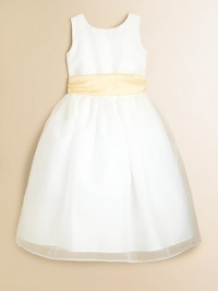 A sleeveless masterpiece for her special moments, designed in pretty organza with a full skirt and contrasting sash at the waist. Built-in slip with crinolineNatural waist with sashBack button closureTea lengthFully linedPolyesterHand washImported A sleeveless masterpiece for her special moments, designed in pretty organza with a full skirt and contrasting sash at the waist. Built-in slip with crinolineNatural waist with sashBack button closureTea lengthFully linedPolyesterHand washImported