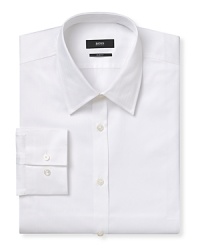 Slim fit shirt with spread collar. Barrel cuffs with two buttons to resize width. Clean front, no pocket. Back yoke with two darts. Rounded hem with triangular gusset inserts. Solid shirt with herringbone textured pattern. Slim fit shirt with spread collar. Barrel cuffs with two buttons to resize width. Clean front, no pocket. Back yoke with two darts. Rounded hem with triangular gusset inserts. Solid shirt with herringbone textured pattern.
