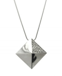 The pinnacle of good style. GUESS's pyramid-shaped pendant features a trendy long chain and sparkling crystal accents. Set in silver tone mixed metal. Approximate length: 30 inches. Approximate drop: 1-1/4 inches. The pinnacle of good style. GUESS's pyramid-shaped pendant features a trendy long chain and sparkling crystal accents. Set in silver tone mixed metal. Approximate length: 30 inches. Approximate drop: 1-1/4 inches.