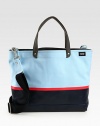 Tote your belongings around town in style this season with this structured canvas bag, dipped in rubber latex for added protection, in contrasting colors that lends a nautical feel to a contemporary design.Double top handlesAdjustable shoulder strapInterior zip pocketCanvas14W x 16H x 6DImported