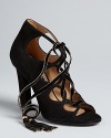 Lace up into Salvatore Ferragamo perfection; these evening sandals offer high style in plush velvet and suede.