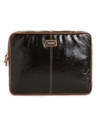 Keep your tech style on point with this ultra-sleek laptop case featuring classic piped edges and easy access zip-around entry. Keep your tech style on point with this ultra-sleek laptop case featuring classic piped edges and easy access zip-around entry.
