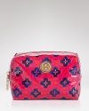 A poppy Tory Burch print dresses up an essential cosmetics case, crafted of coated poplin.