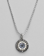 Rings of mysterious black diamonds, sparkling white diamonds and cool blue sapphires make a glamorous pendant set in 14k white gold. Diamonds, 0.26 tcw Sapphires 14k white gold Chain length, about 16 Medallion diameter, about ½ Lobster clasp Imported