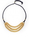 THE LOOKThree bold, graduated golden chainsDouble strands of braided navy cordSliding, adjustable lariat-style bead closeTHE FITChain length, about 9Overall length, about 42THE MATERIALRayon cord24k gold platingORIGINMade in USA