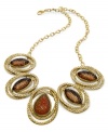An alluring look from Style&co. Acrylic stones in topaz hues captivate on a golden chain. Crafted in antiqued gold tone mixed metal. Approximate length: 18 inches. Approximate drop: 1-3/4 inches.