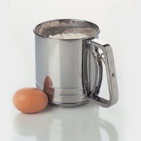 Sift flour or dry ingredients for perfect cakes or pastries with this 5-cup sifter from Amco. Constructed of stainless-steel with a contemporary design. Sift flour or dry ingredients for perfect cakes or pastries with this 5-cup sifter from Amco. Constructed of stainless-steel with a contemporary design.
