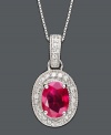 Keep this stunning king of gemstones close to your heart. Oval-cut ruby (1-1/2 ct. t.w.) pendant in 14k white gold setting encrusted with round-cut diamond (1/5 ct. t.w.). Approximate length: 18 inches. Approximate drop: 7/8 inch.