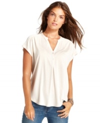 Inspired by a casual henley top, this Calvin Klein Jeans look gets a refined touch thanks to a flowing fabric and pretty pleats at the shoulders. Wear it to work with a skirt, or keep it casual with jeans! Inspired by a casual henley top, this Calvin Klein Jeans look gets a refined touch thanks to a flowing fabric and pretty pleats at the shoulders. Wear it to work with a skirt, or keep it casual with jeans!