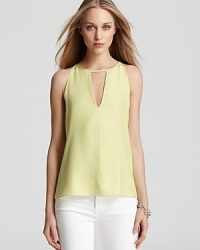 An vivid Parker top with a cutout at the neckline makes the perfect teammate to crisp white pants for a polished look when you're headed to the clubhouse. An vivid Parker top with a cutout at the neckline makes the perfect teammate to crisp white pants for a polished look when you're headed to the clubhouse.