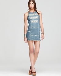 A tribal-embroidered Free People chambray dress marries boho with downtown sensibilities for an eclectic look that appeals to your idiosyncratic style. A tribal-embroidered Free People chambray dress marries boho with downtown sensibilities for an eclectic look that appeals to your idiosyncratic style.