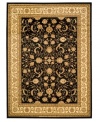 Dazzling mystery. Capturing the intricacies of ancient Persian designs, the Lyndhurst area rug presents an updated version in gorgeous ivory over a black ground. Made with durable polypropylene in a soft, low pile for the modern home.