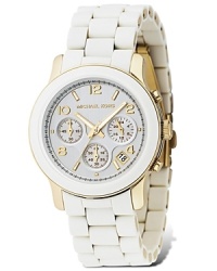 White, so timely this season, is here from MICHAEL Michael Kors on a three-eye chronograph With white bracelet strap, a round dial with shiny silver Arabic numbers and stick indices. White, so timely this season, is here from MICHAEL Michael Kors on a three-eye chronograph With white bracelet strap, a round dial with shiny silver Arabic numbers and stick indices.