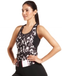 Sporty gets stylish in this great tank top from Ideology. A built-in shelf bra offers support for low-impact workouts, while the printed design lends a fashionable touch to the gym. Sporty gets stylish in this great tank top from Ideology. A built-in shelf bra offers support for low-impact workouts, while the printed design lends a fashionable touch to the gym.