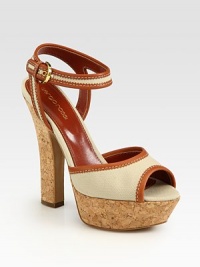 Lifted by a cork heel and platform, breathable canvas is topped with rich Italian leather trim and an adjustable ankle strap. Cork heel, 5 (125mm)Cork platform, 1 (25mm)Compares to a 4 heel (100mm)Canvas and leather upperLeather lining and solePadded insoleMade in ItalyOUR FIT MODEL RECOMMENDS ordering true size. Lifted by a cork heel and platform, breathable canvas is topped with rich Italian leather trim and an adjustable ankle strap. Cork heel, 5 (125mm)Cork platform, 1 (25mm)Compares to a 4 heel (100mm)Canvas and leather upperLeather lining and solePadded insoleMade in ItalyOUR FIT MODEL RECOMMENDS ordering true size.