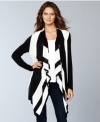 Long and made for layering, INC's cool cascade cardigan works its style magic in bold black and white stripes.